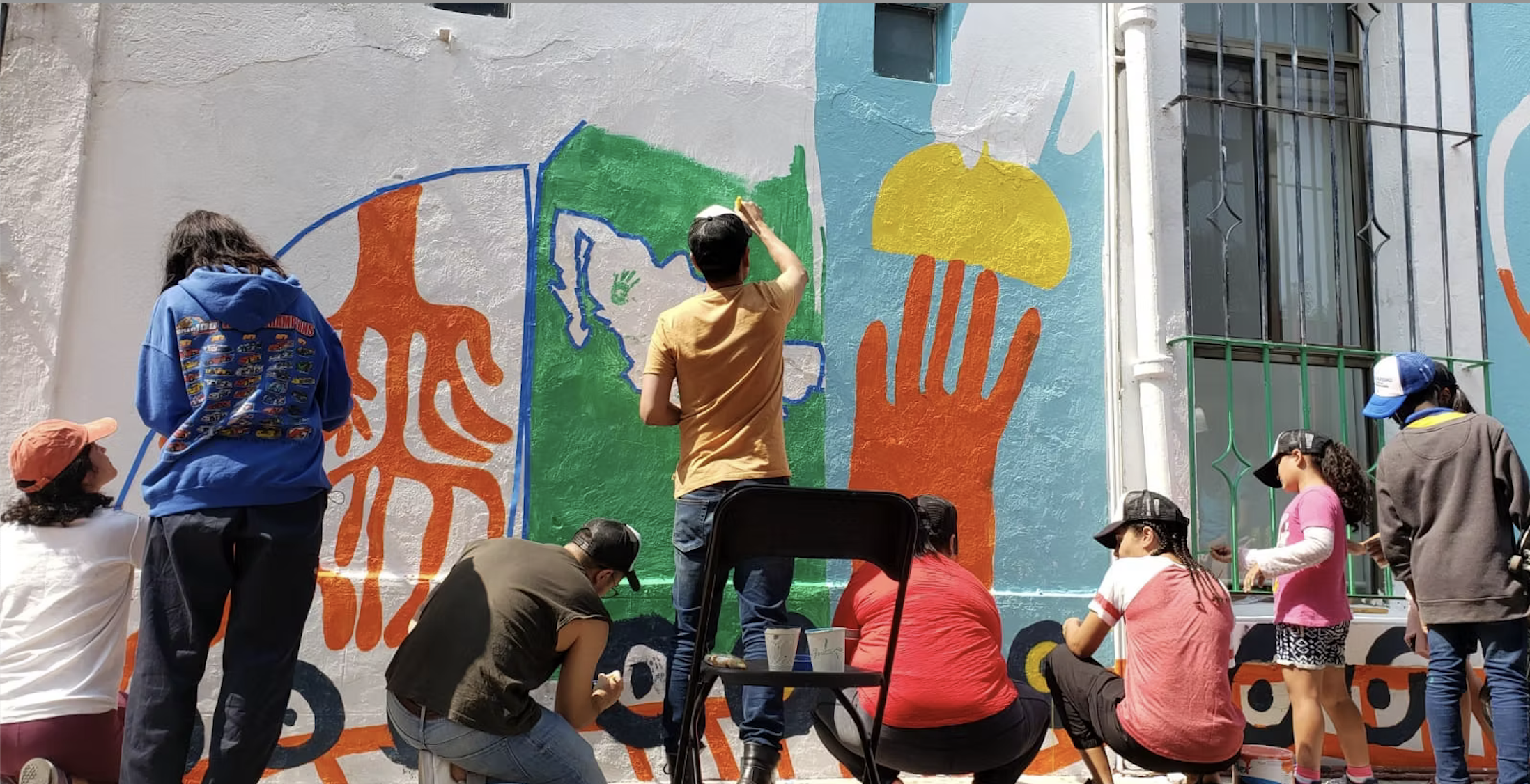 Mural participativo sobre migración con la ONU — ilustración de Camdelafu